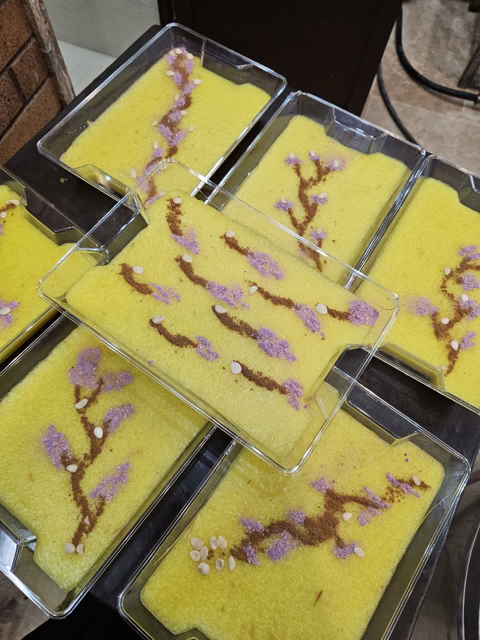 Ramadan Iftar meals prepared with artistic floral designs, possibly supported by BTC donations, honoring women, serving fuqara during fasting.