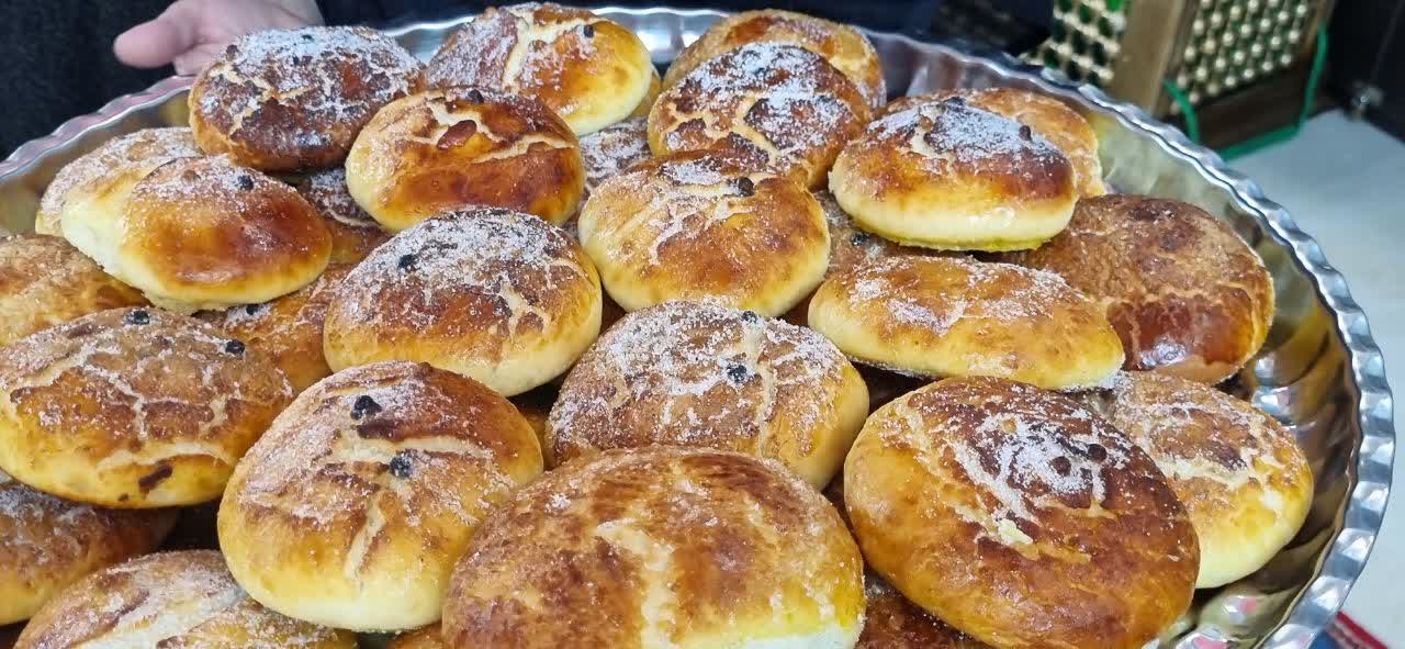 Freshly baked sweet buns topped with powdered sugar and raisins, offered during Ramadan by Our Islamic Charity, with support from crypto donors like those using BTC.
