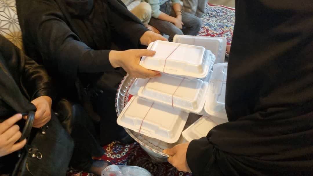 Serving Iftar meals to women during Ramadan, supported by crypto donations like BTC.
