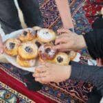 Women share sweets and break fast during Ramadan and International Women's Day, with aid potentially supported by BTC donations.