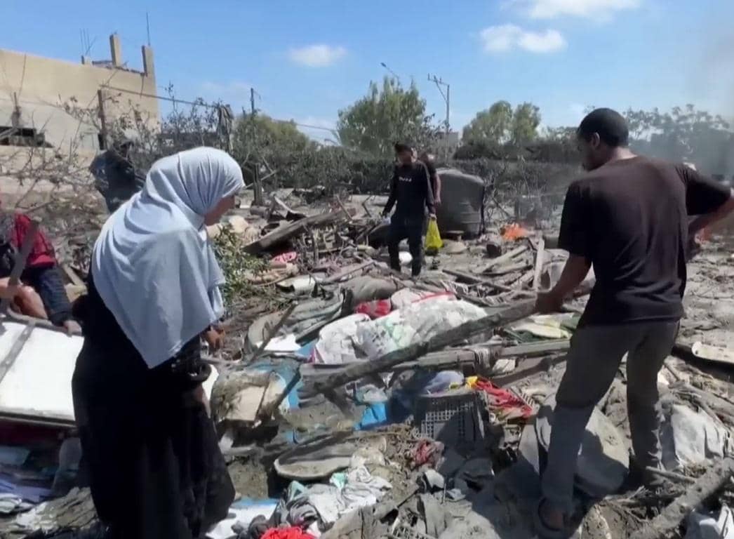 Yemen aid workers sift through rubble after airstrikes, accepting BTC donations for urgent relief like clean water and medical supplies.