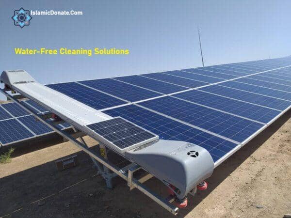 Water-free solar panel cleaning robot in operation in a desert environment, conserving water and enhancing renewable energy projects, supported by SOL donations.