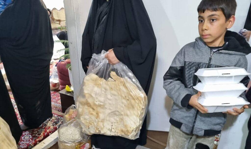 Zakat donation of fresh bread and food containers for Palestinians, with BTC crypto support.