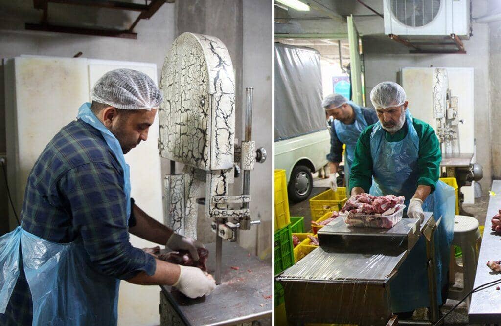 Men in hairnets and aprons processing sacrificial meat with a band saw and scales for distribution across Africa and Asia on Eid al-Adha, facilitated by crypto donations like Bitcoin and Ethereum.