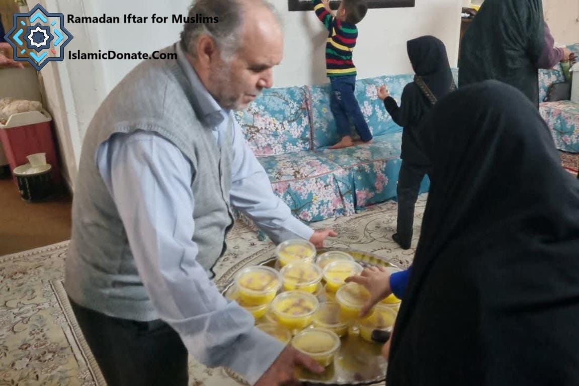 Man presenting a tray of food containers for kaffarah donation, likely for Ramadan Iftar, supported by cryptocurrency like Monero.