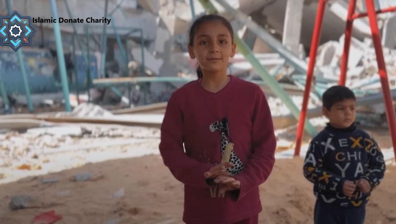 Children in front of destroyed buildings, a testament to the hope your crypto donations create through Islamic Donate Charity, supporting education with BTC.