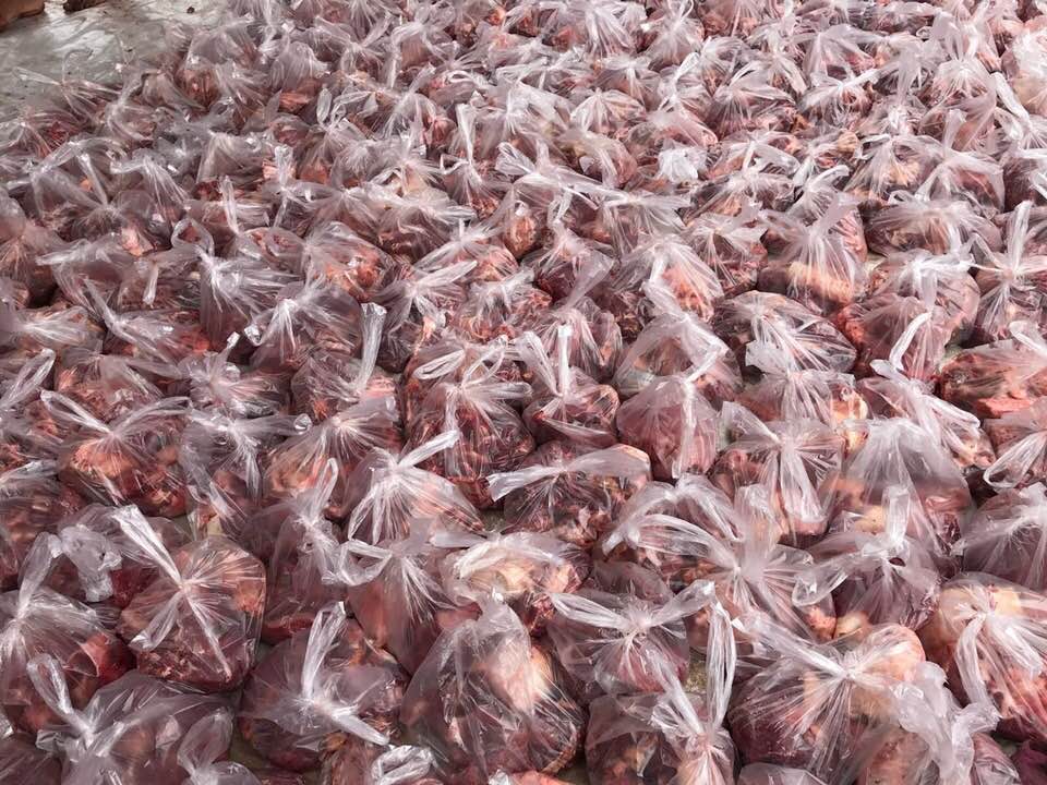 Relief Qurbani donations of meat in plastic bags, supporting global food security through crypto aided charitable giving via USDT.