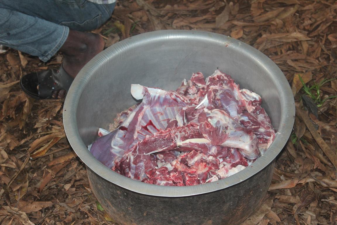 A large metal pot filled with freshly cut Qurbani meat, on a background of dry leaves. Crypto donations, using Bitcoin, help feed the needy with dignity on Eid al-Adha.