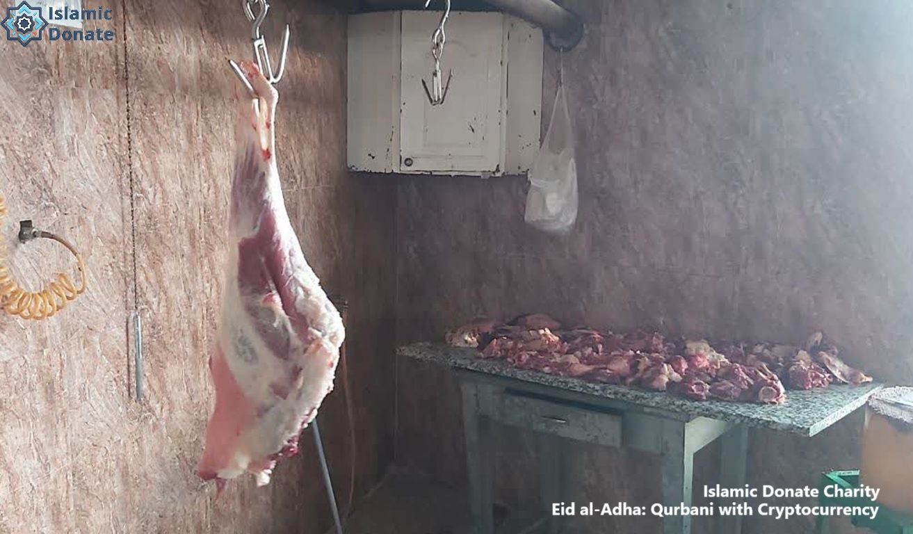 Qurbani meat distribution via crypto donation. A whole carcass hangs, with chopped meat on a table, symbolizing aid for the needy. Eid al-Adha with USDT.