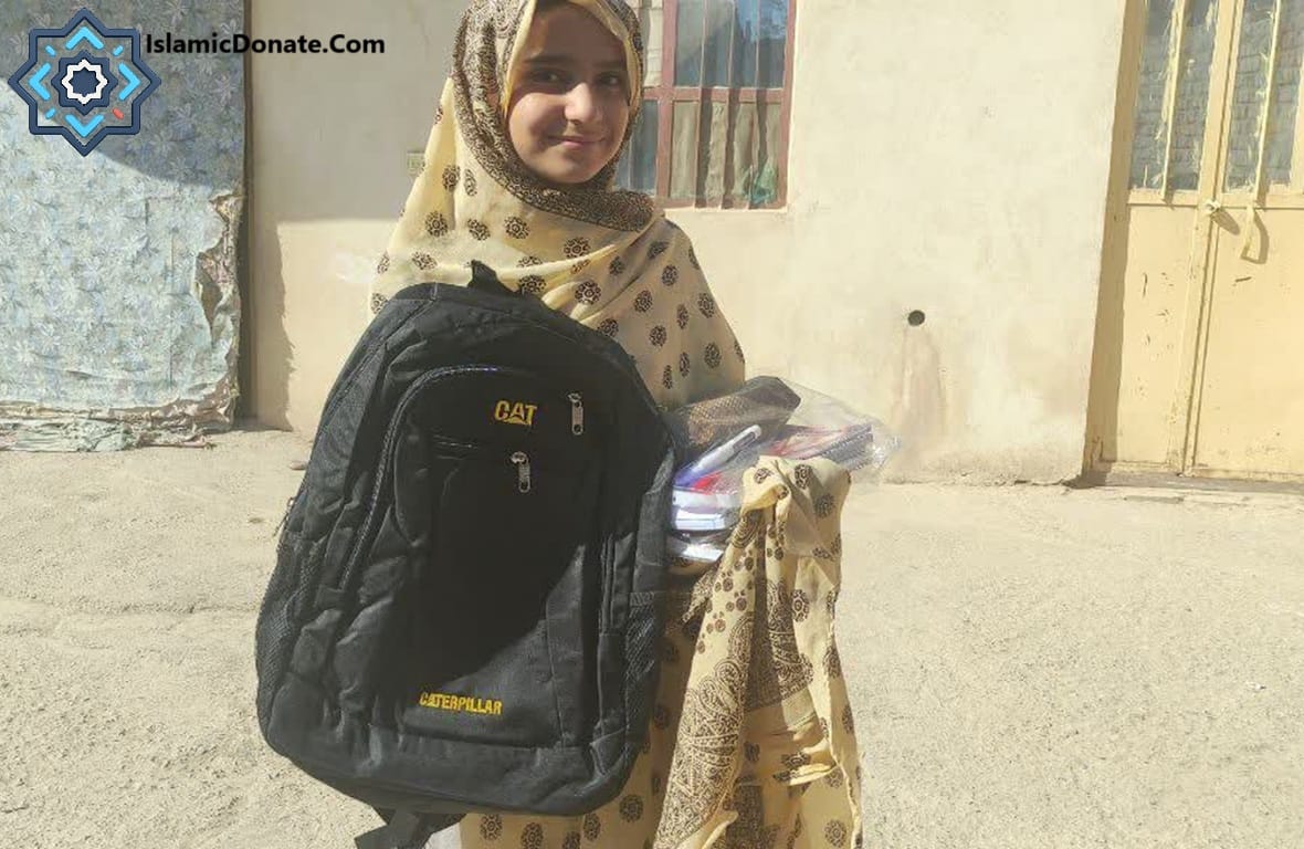 Young girl holding a backpack and school supplies, a beneficiary of charity donations funded by cryptocurrency like USDC.