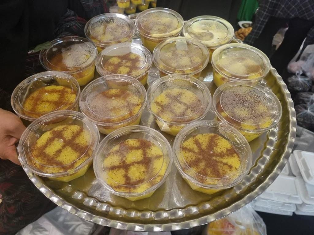 Prophet's birthday sweets in clear cups with cinnamon designs, prepared for community distribution. Donate with crypto like USDT to support charity.