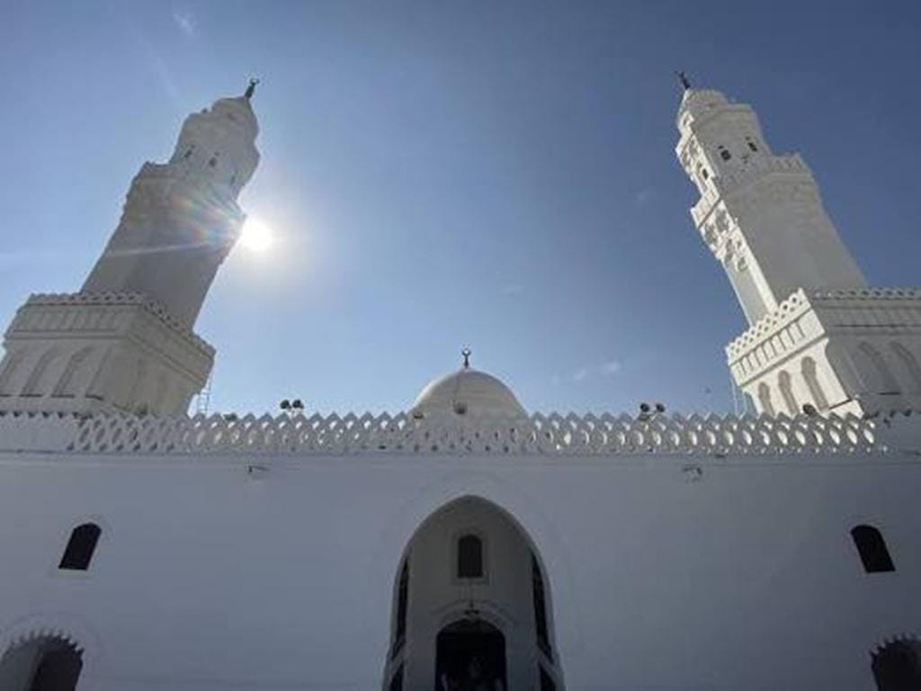 Masjid al-Qiblatain in Medina marks the shift of Qibla to Ka'ba. The mosque is white and is photographed from the outside during the day.