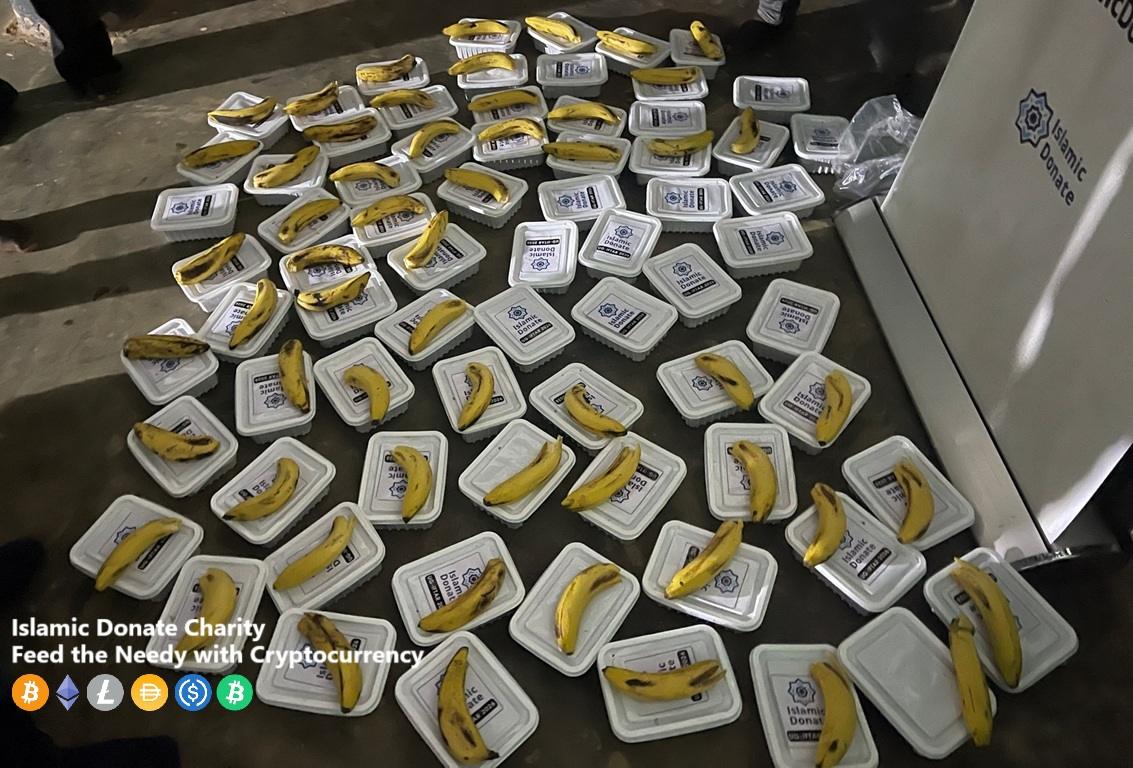 Many portions of food aid with bananas are prepared for donation, supported by crypto. Feed the Needy with Cryptocurrency like SOL.