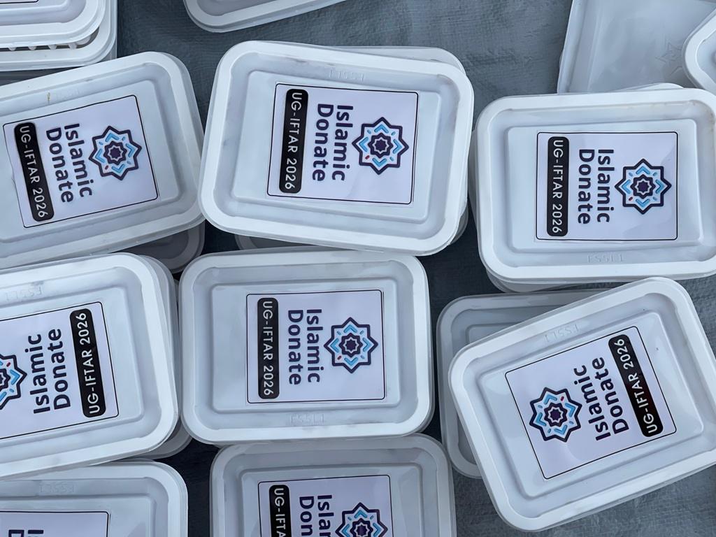 Pay Kaffarah online meals for feeding the poor with Bitcoin. Containers labeled UG-IFTAR serve those in need through charity.