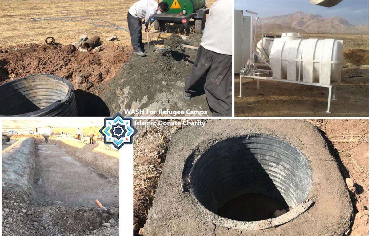 Refugee camp WASH facility construction featuring a water tank and underground pipe installation. Donate with BTC for urgent aid.