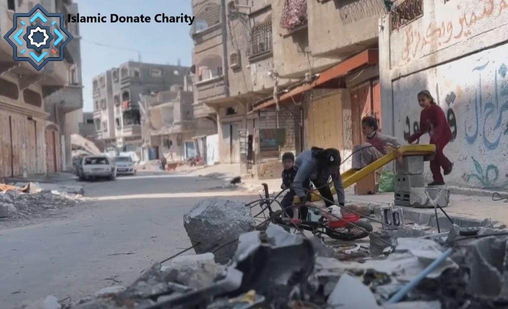 Children playing on a makeshift seesaw in a war-torn street, a scene of resilience made possible by crypto donations like Bitcoin.