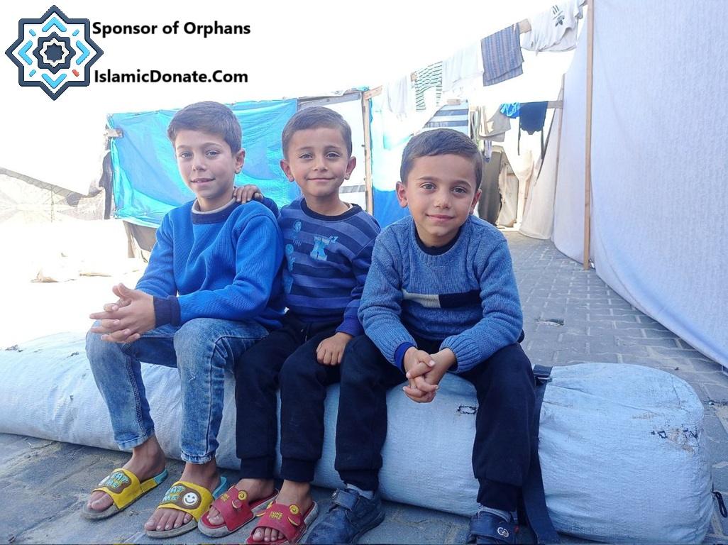 Three young boys sit together. Sponsor of Orphans is featured. Donate with Pax-gold to help orphans during Laylatul Qadr.