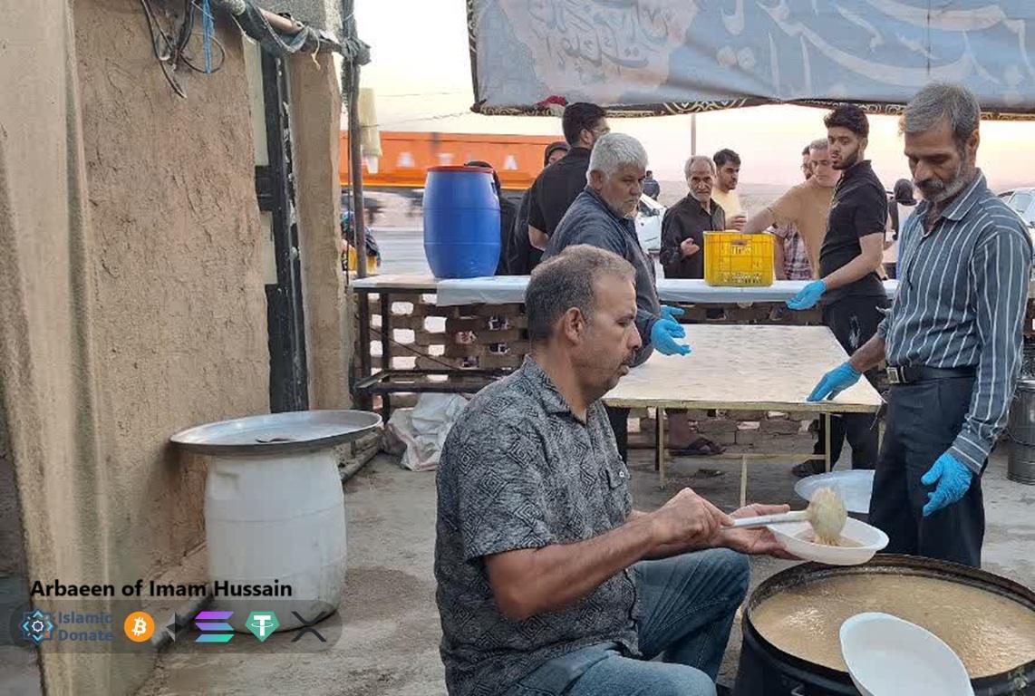 Arbaeen Walk pilgrims receiving hot meals funded by BTC crypto. Volunteers serve food on the route from Najaf to Karbala.