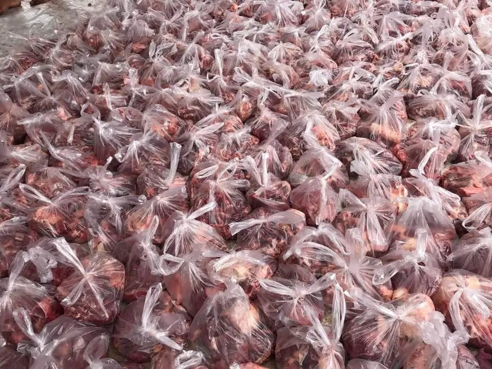 Relief Qurbani donations of meat in plastic bags, supporting global food security through crypto aided charitable giving via USDT.