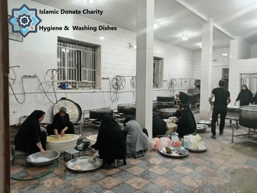Arbaeen pilgrimage Hygiene and Washing Dishes for pilgrims funded by USDC. Volunteers wash bowls in a mawkib kitchen.
