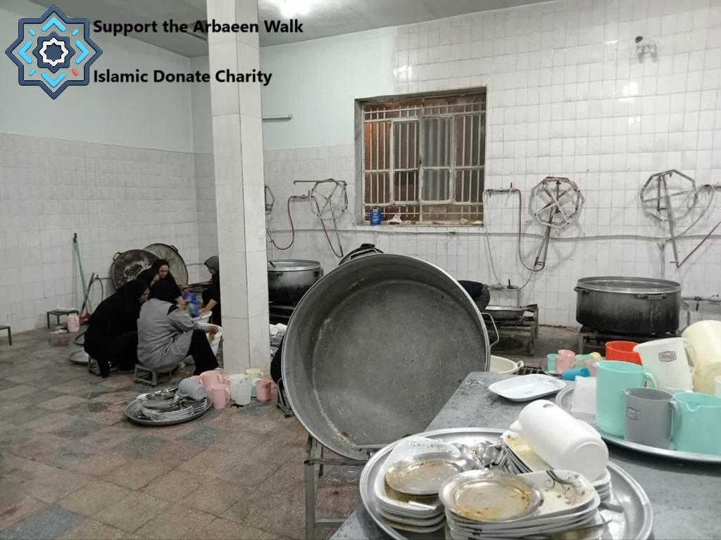 Arbaeen Pilgrimage relief volunteers cleaning dishes for pilgrims funded by Monero crypto donations in a kitchen.