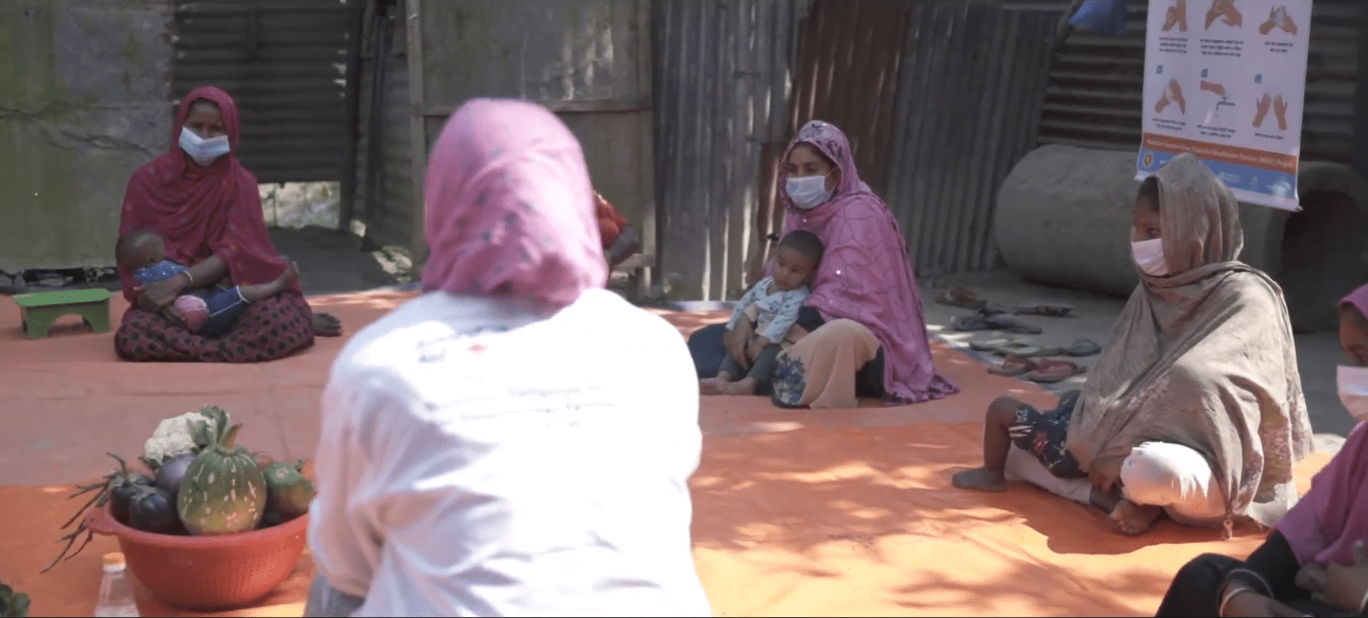 Women attend a healthcare and self-care workshop, receiving health education and aid, supported by crypto donations like ETH.