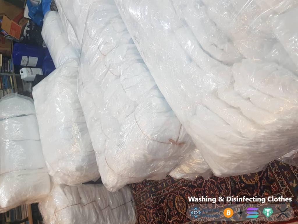 Plastic wrapped bundles of clothing for Palestinian relief efforts funded by crypto donations like PayPal USD. Washing Disinfecting