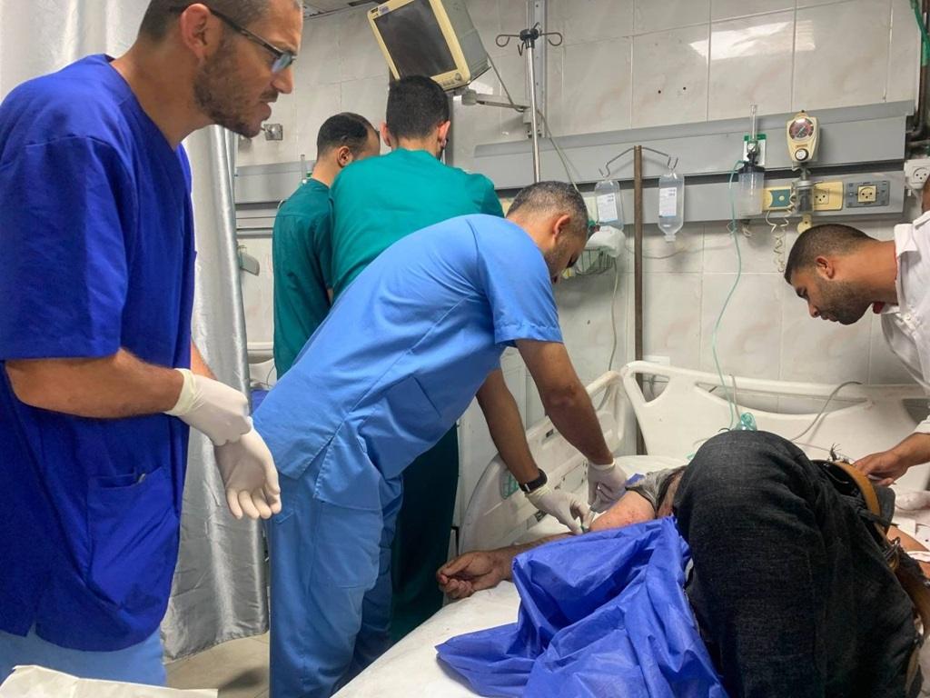 Medical staff provide urgent care to a patient in a Gaza clinic supported by BNB donations for essential relief supplies.