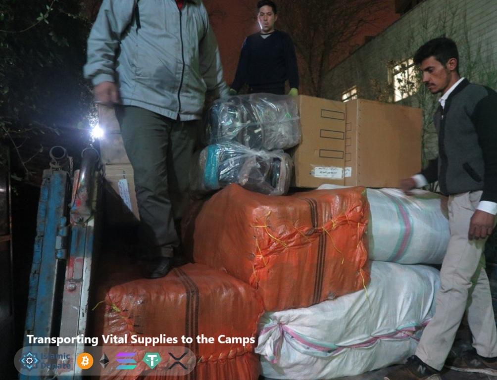 Volunteers unload humanitarian aid packages for Palestinian displaced camps to support relief efforts.