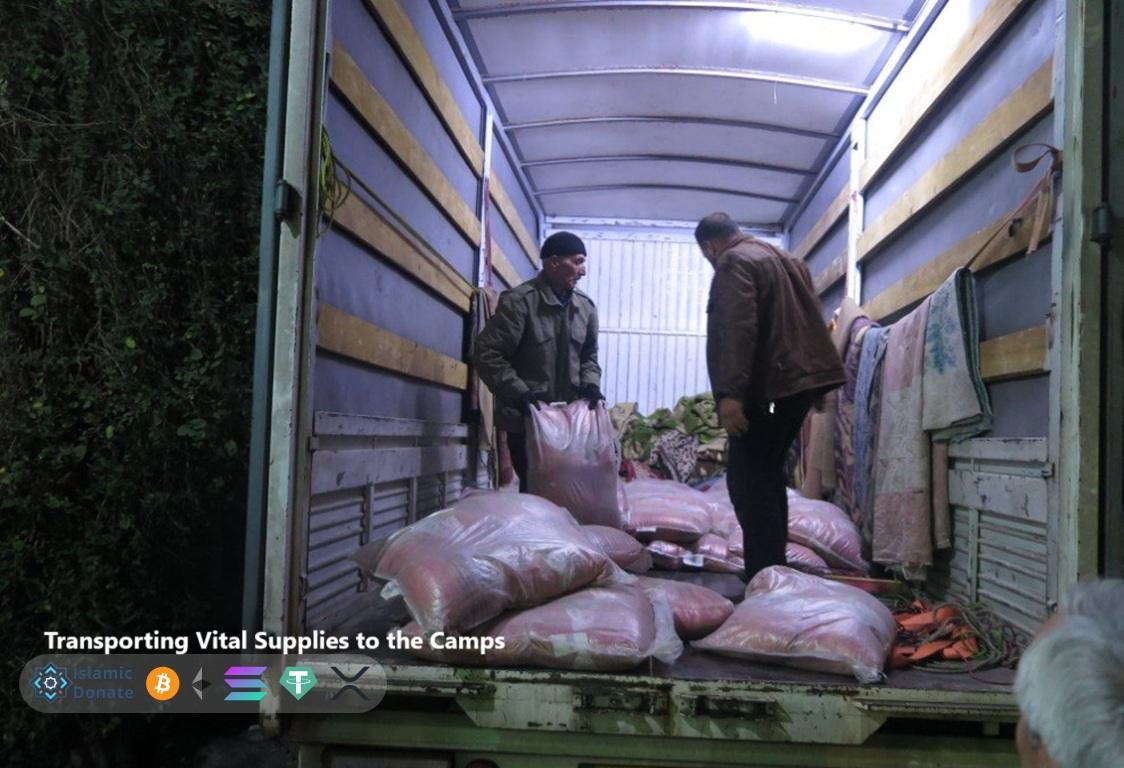 Volunteers load relief supplies into truck for Palestine refugee camps. Support humanitarian aid with USDC.