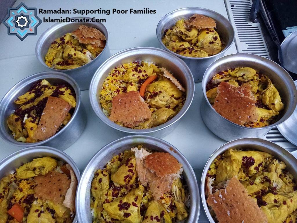 Ramadan meals of rice, chicken, and bread in serving bowls, supporting poor families with crypto donations made via Stablecoin.