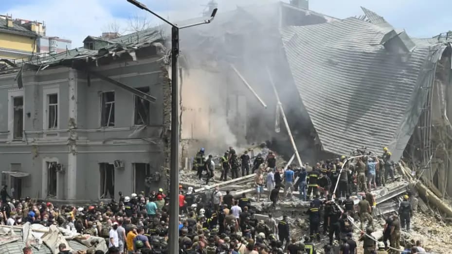 Kyiv children's hospital attack aftermath with rescue workers amid rubble. Crypto donations of medical supplies and food for Ukraine are urgently needed, potentially via ETH.