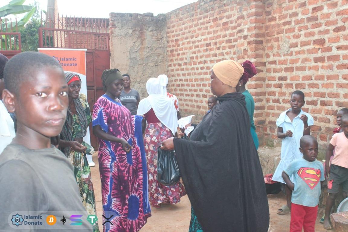 Ramadan Relief for needy families supported by Dogecoin crypto donations at an outdoor community center event.