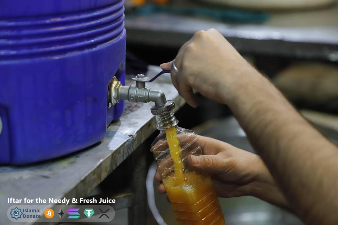 Distribution pours fresh juice into bottles for the needy using LTC support from crypto donors.