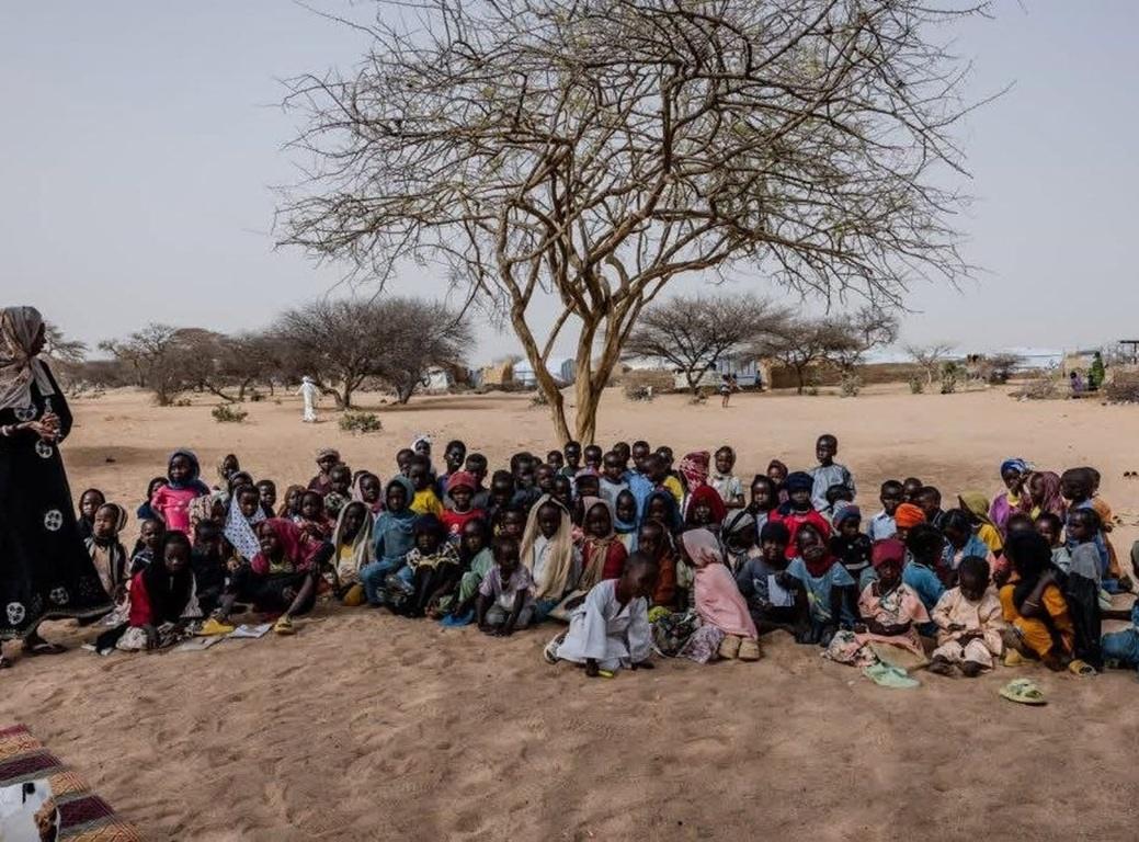 Needy Muslims gather for meals in war zones to break the fast. Iftar Ramadan food aid for children in refugee camps via XRP.