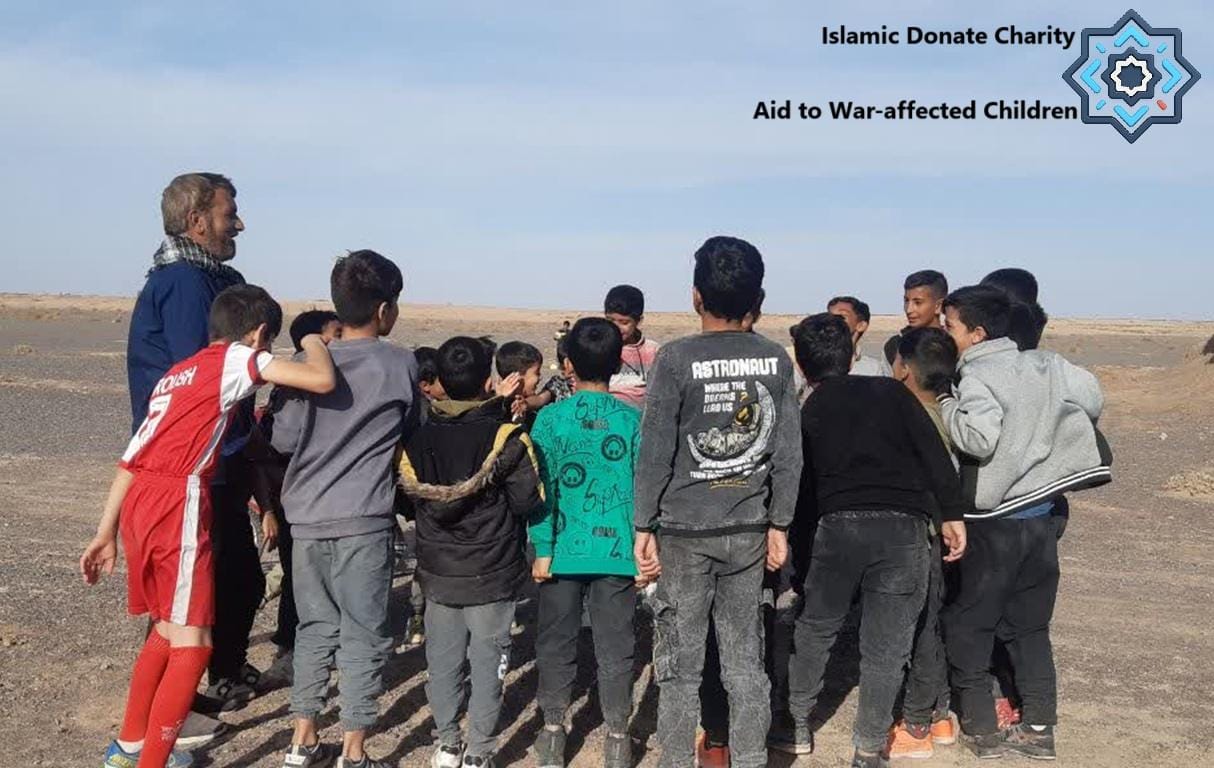 Aid to war-affected children in Lebanon receiving support from Islamic Donate Charity. Groups of children and an adult stand in a dusty, open area. Donations can be made via cryptocurrency like BTC, ETH, and USDT.