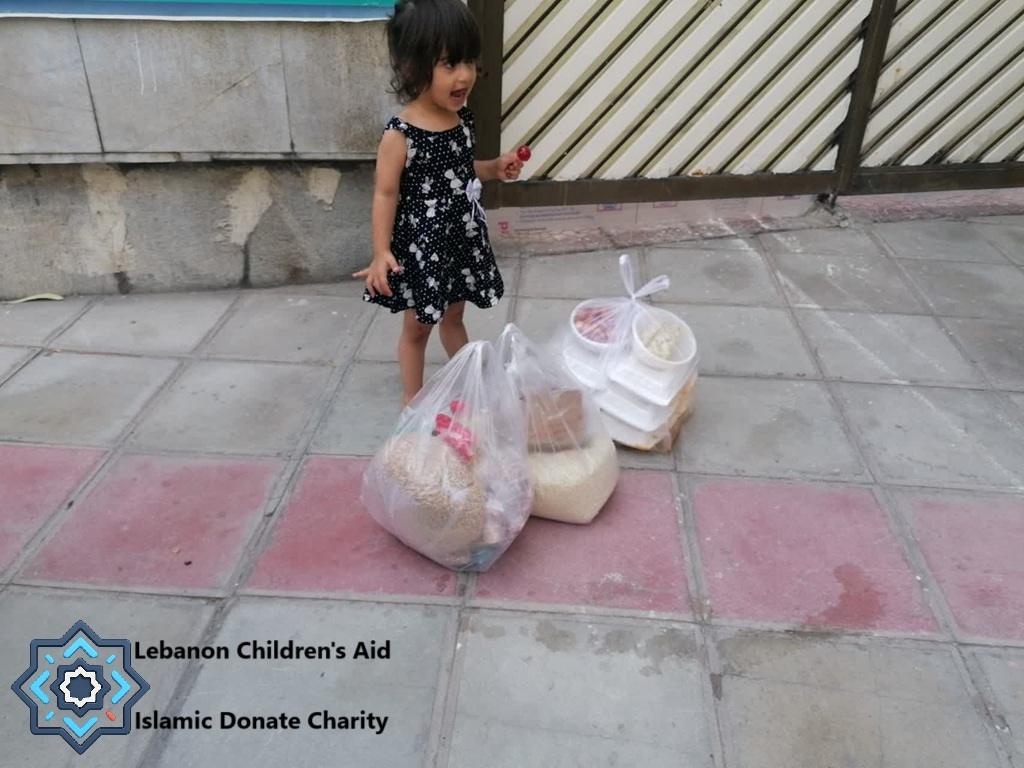 Lebanon child with food aid parcels, supported by crypto donations like USDC.