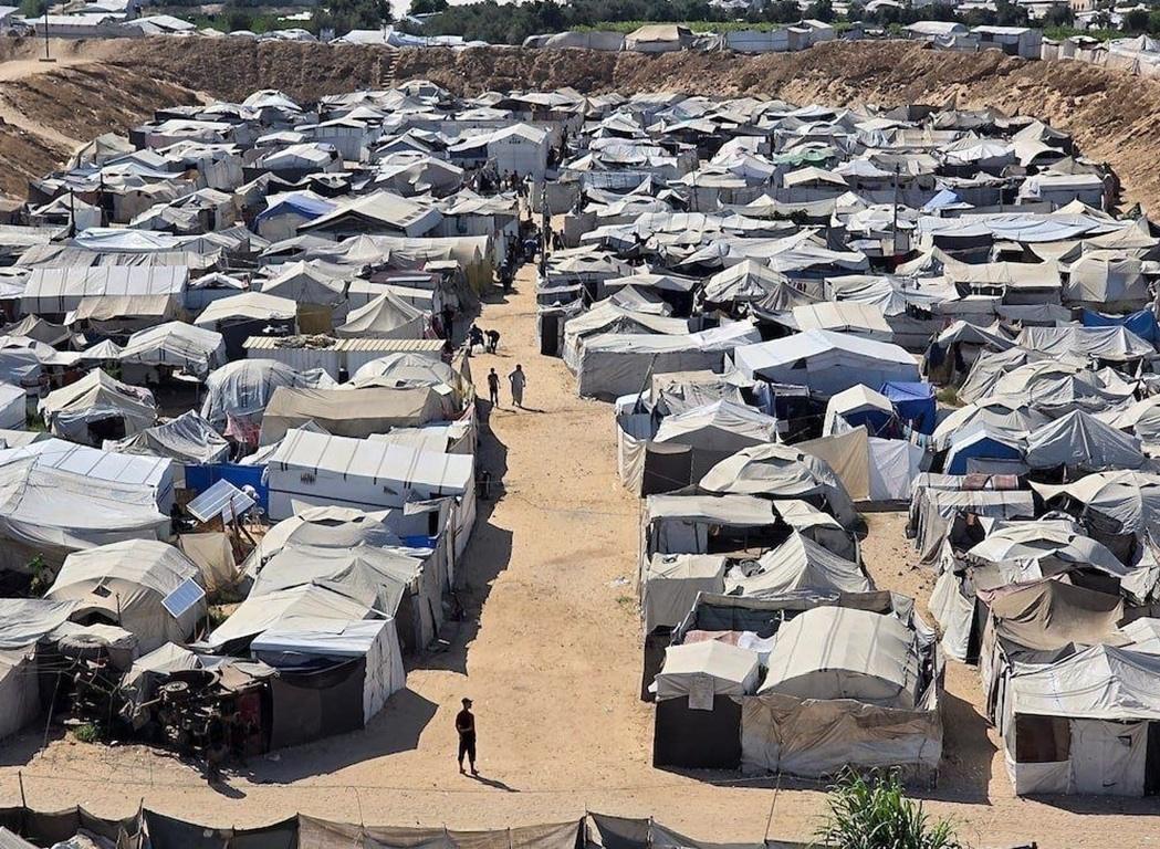 Displaced families reside in Gaza tent camps requiring urgent humanitarian aid and crypto support via SOL donations.