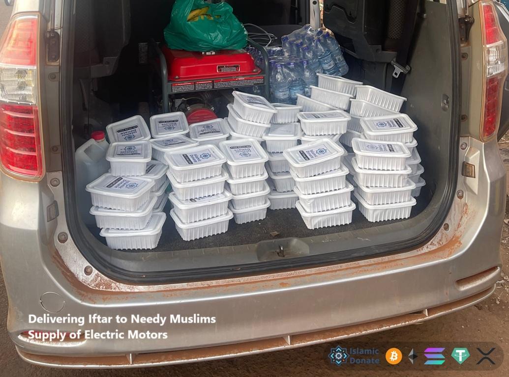 Iftar meal boxes and water bottles in a van trunk for needy families funded by Stablecoin donations. Give Crypto Zakat in Ramadan.