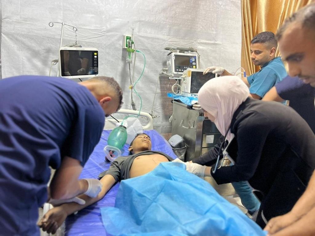 Medical staff treating a patient in a Palestinian hospital using BNB donations for essential medicine and supplies