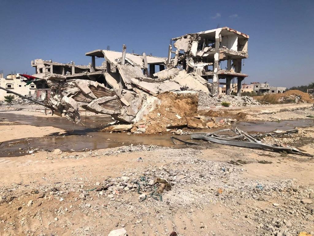 Reconstruction support via XAUT for destroyed buildings in Palestine, aiding families affected by intense conflict crisis.