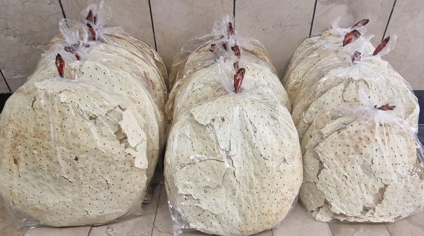 Stacks of large, thin, round flatbreads packaged in clear plastic bags, ready for distribution. These loaves symbolize resilience and hope for Palestinians, with donations supporting aid efforts via crypto like USDT.