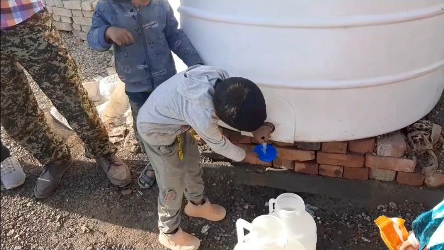 Children collecting water from a tank, immediate relief and access to clean water through crypto donations like BTC.