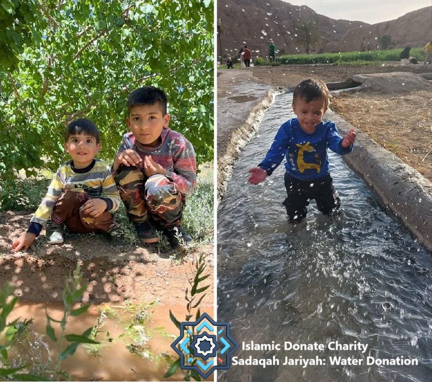 Two young boys in an outdoor setting. One boy plays in a water channel,splashing water, while the other squats beside him. The scene highlights the impact of Sadaqah Jariyah water projects, supported by stablecoin donations.