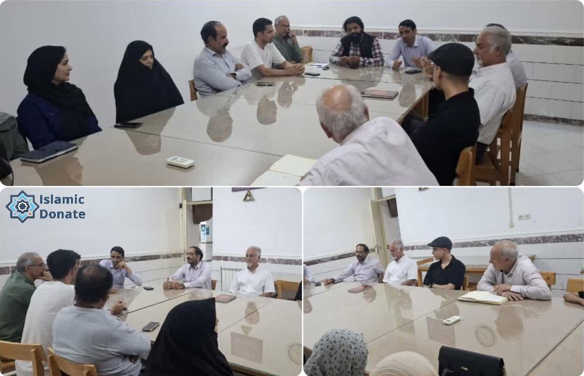 A group of people, including men and women, sit around a table discussing projects. Local trustees offer expertise to define, execute, monitor, and inspect crypto charitable projects.