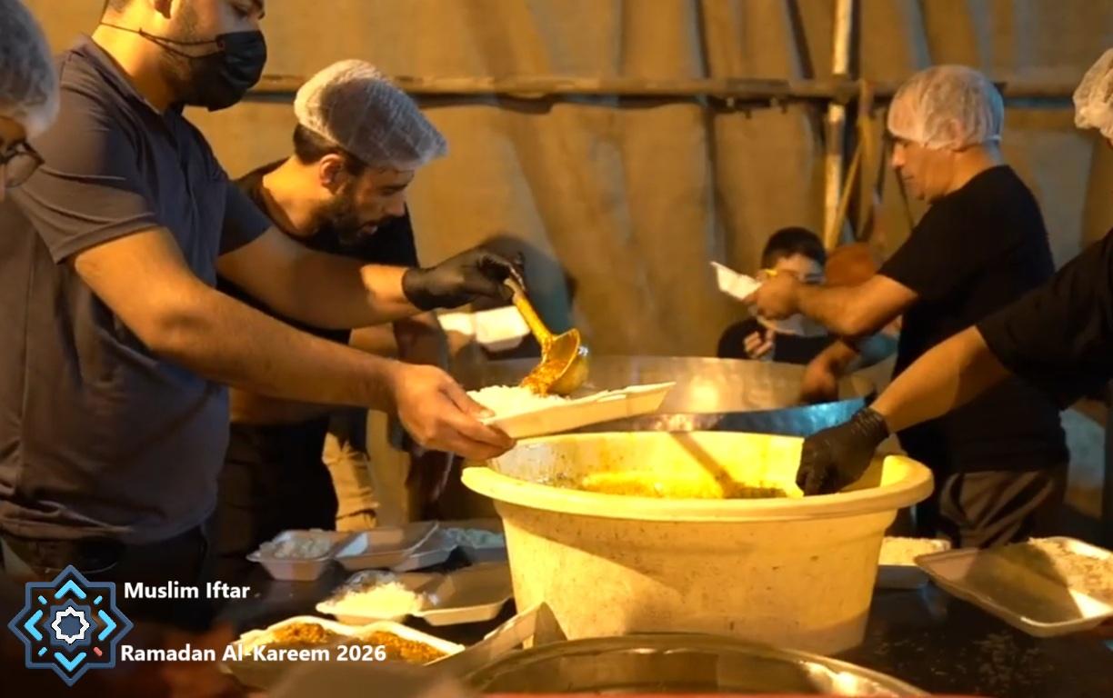 Volunteers serve hot meals to families during Ramadan 2026, funded by cryptocurrency donations via PayPal USD.