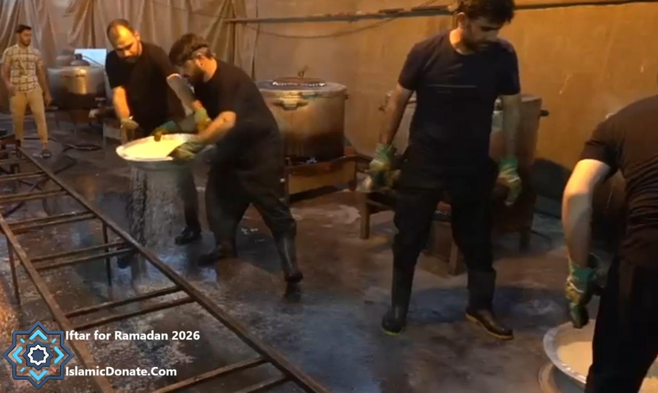 Volunteers preparing Iftar meals in a kitchen, distributing food to vulnerable families. Crypto donations enable swift relief efforts in war zones.
