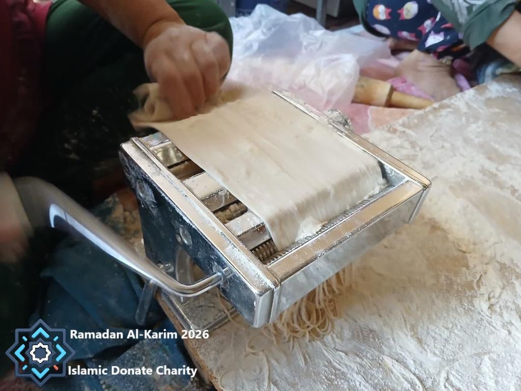 Drying noodles made from 5 tons of flour by village women, powered by crypto donations like USDC, ensuring food security for Ramadan 2026.