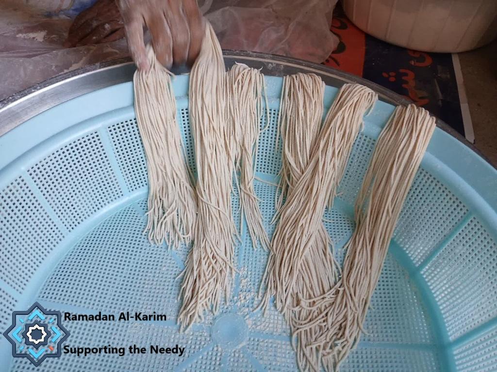 Making dried noodles by hand, crypto donations fund sustenance. Ramadan Al-Karim Supporting the Needy campaign.