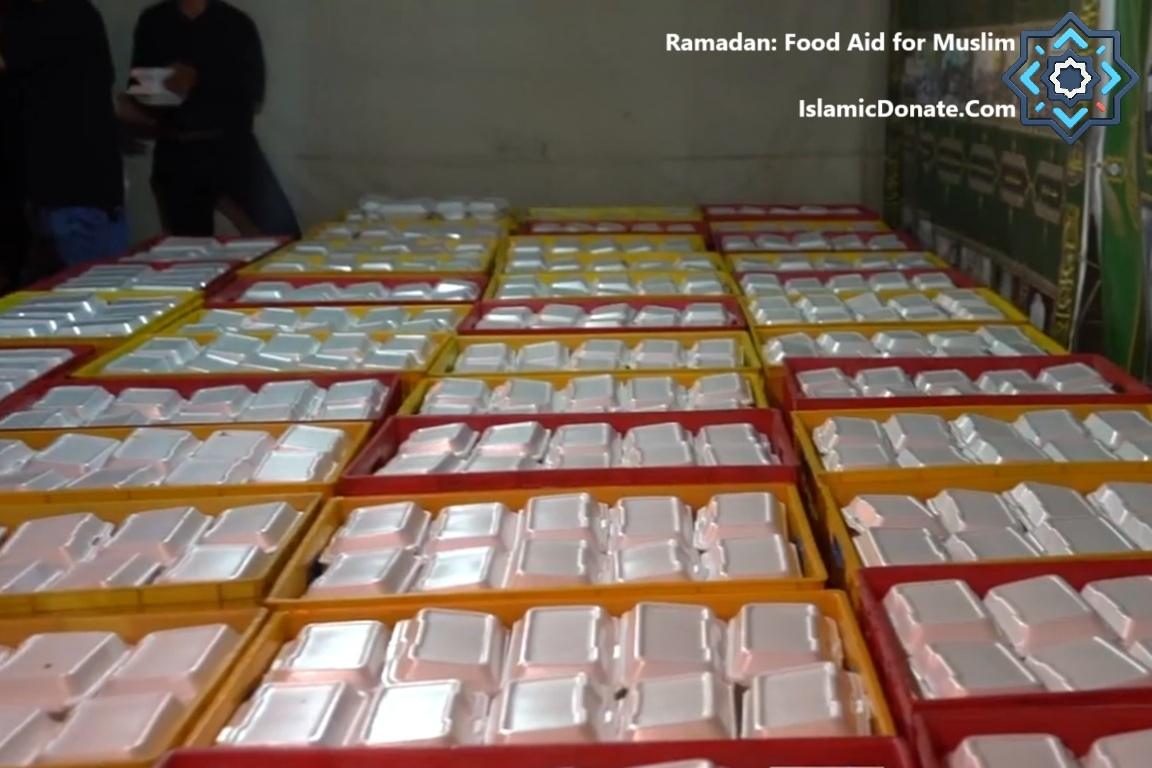 Rows of packed Iftar meals ready for distribution, enabled by crypto donations like SOL. Ramadan food aid for needy Muslims.